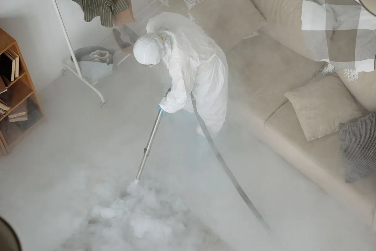 Biohazard cleanup technician in protective equipment, Lake Como, Orlando, FL